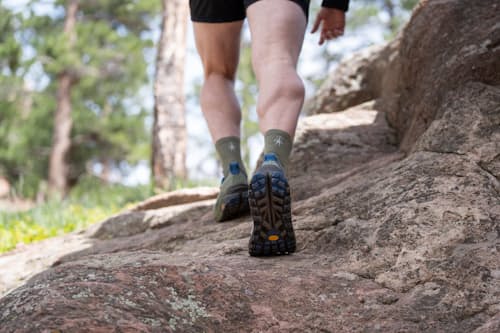 lifestyle image of Olympus 6 Trail Running Sneaker