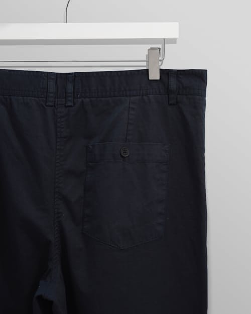 laydown detail image of Raleigh Pleated Tapered Pant