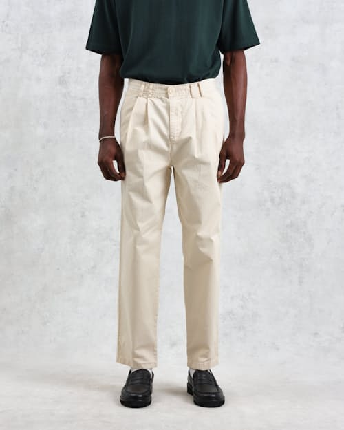 on model image of Raleigh Pleated Tapered Pant