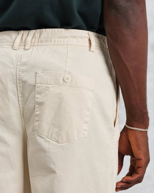 on model image of Raleigh Pleated Tapered Pant