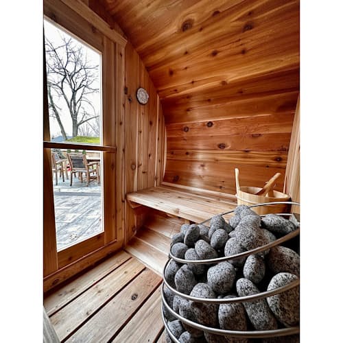 lifestyle image of The Eddy Barrel Sauna with Roof Kit