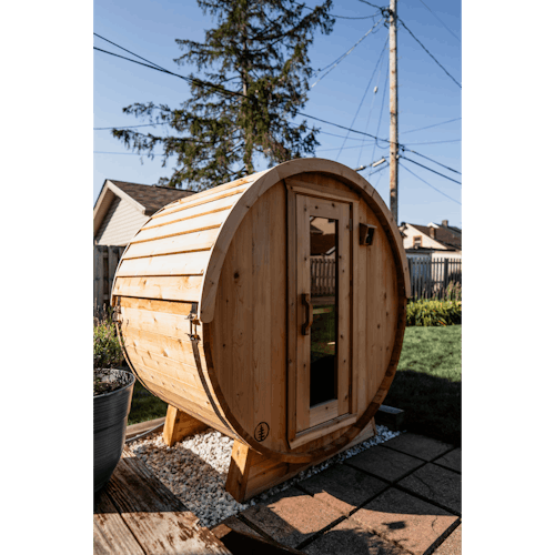 lifestyle image of The Eddy Barrel Sauna with Roof Kit