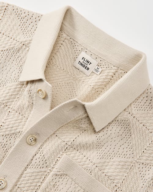 laydown detail image of Textured Button-Up Sweater Polo