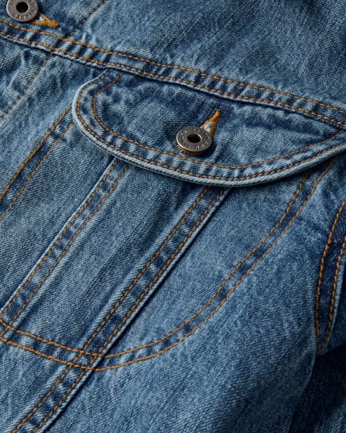laydown detail image of Flannel-Lined Denim Trucker Jacket