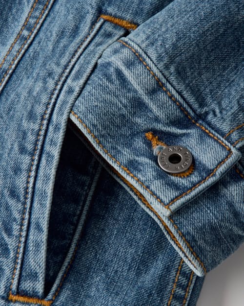 laydown detail image of Flannel-Lined Denim Trucker Jacket