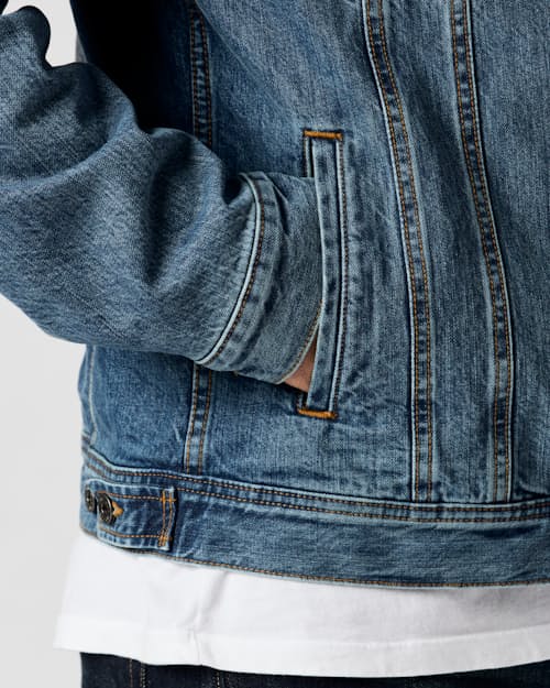on model image of Flannel-Lined Denim Trucker Jacket