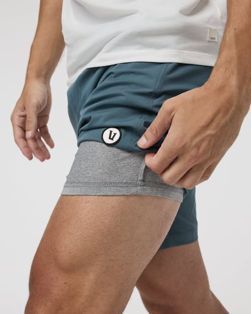 on model image of Kore Performance Shorts - 7.5"