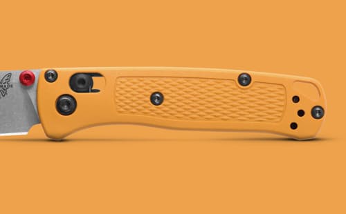 lifestyle image of Mini Bugout Daybreak Yellow Grivory Pocket Knife