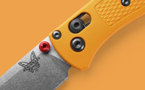 lifestyle image of Mini Bugout Daybreak Yellow Grivory Pocket Knife