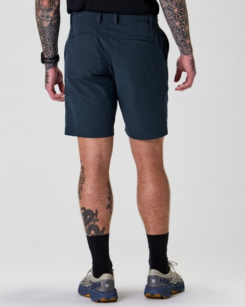 on model image of Equator Cargo Hybrid Short - 9"