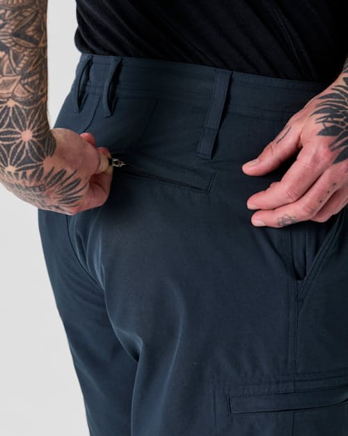 on model image of Equator Cargo Hybrid Short - 9"