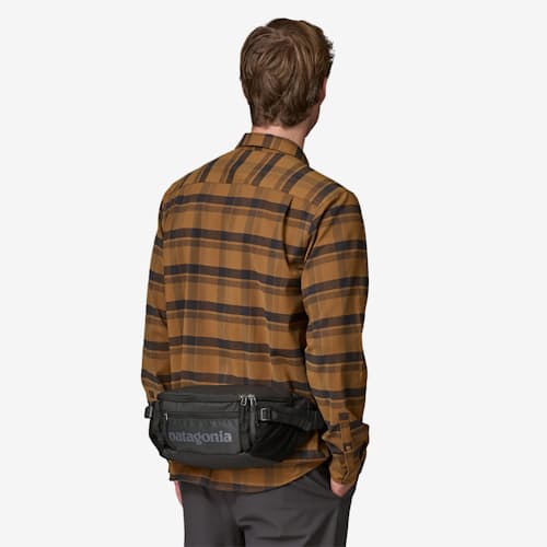 on model image of Black Hole Waist Pack Sling - 5L