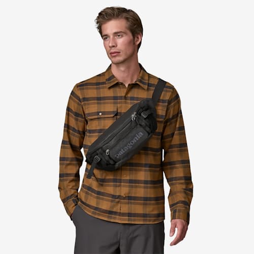 on model image of Black Hole Waist Pack Sling - 5L