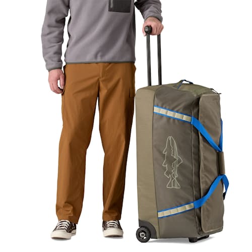 on model image of Black Hole Wheeled Duffel - 100L