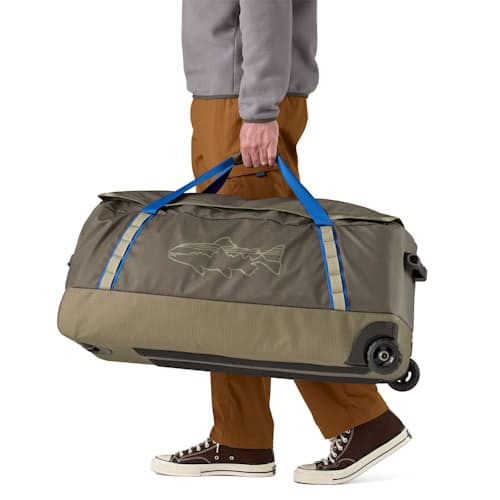 on model image of Black Hole Wheeled Duffel - 100L