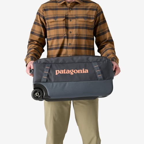 on model image of Black Hole Wheeled Duffel - 40L