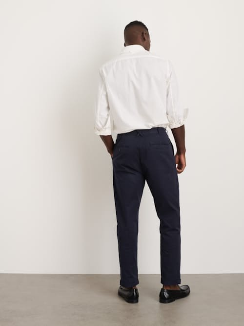 on model image of Standard Pleated Chino Pant