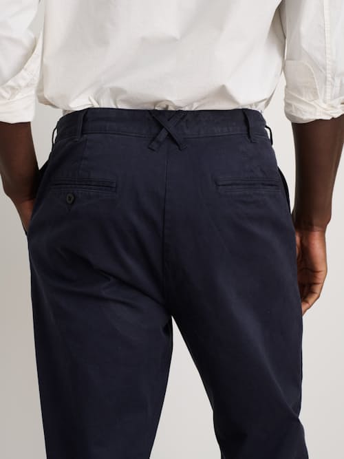 on model image of Standard Pleated Chino Pant