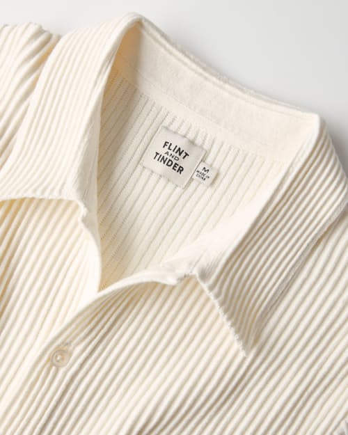 laydown detail image of Ribbed Button-Up Sweater Polo
