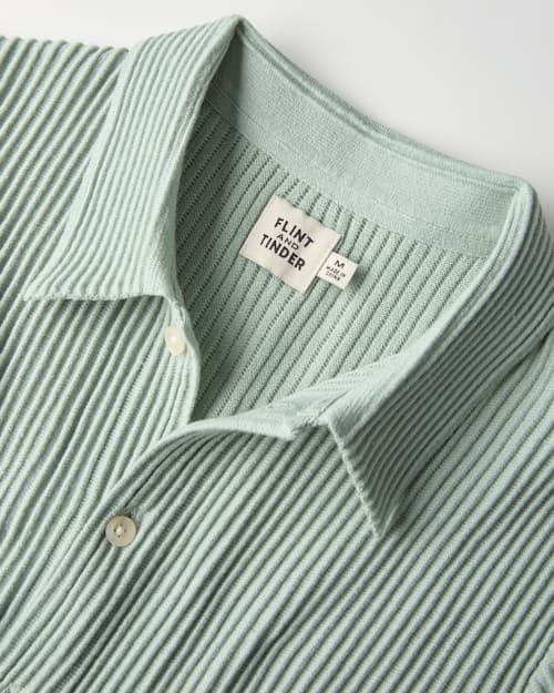 laydown detail image of Ribbed Button-Up Sweater Polo