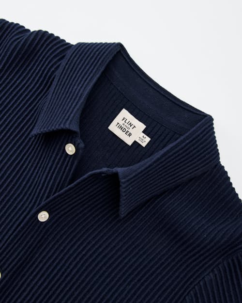 laydown detail image of Ribbed Button-Up Sweater Polo