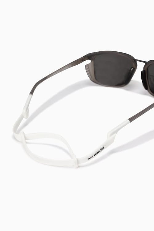 laydown detail image of District Vision x and wander Sunglasses