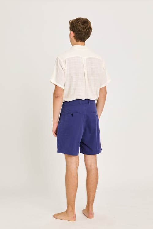 on model image of Lapa Double Pleated Canvas Shorts