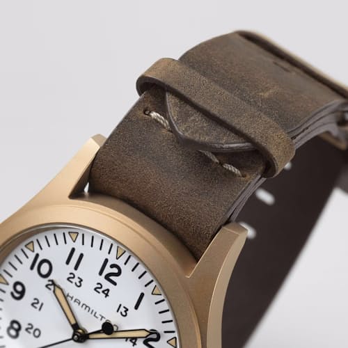 laydown detail image of Khaki Field Mechanical Bronze 38mm Watch
