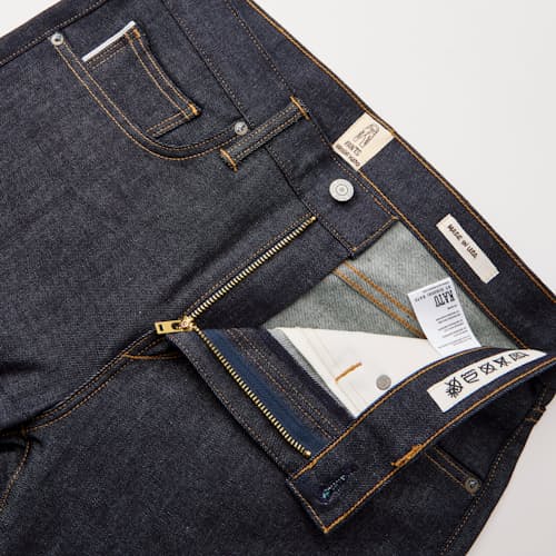 laydown detail image of The Scissors Slim Tapered Stretch Selvedge Denim Jeans
