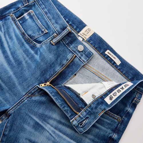 laydown detail image of The Scissors Slim Tapered Stretch Selvedge Denim Jeans