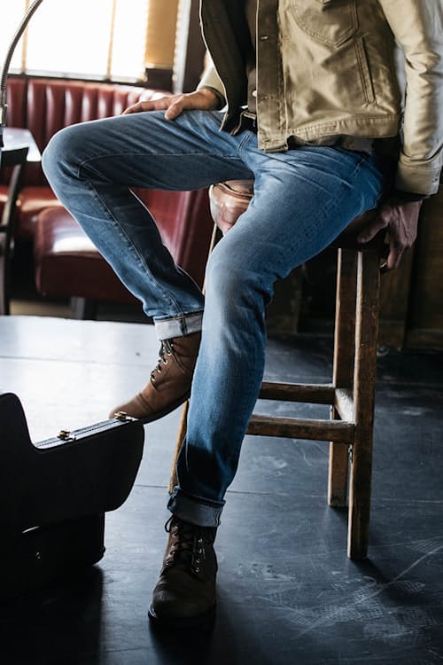 lifestyle image of The Scissors Slim Tapered Stretch Selvedge Denim Jeans