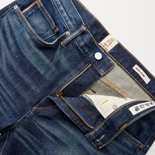 laydown detail image of The Scissors Slim Tapered Stretch Selvedge Denim Jeans