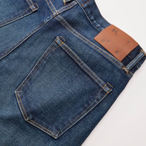 laydown detail image of The Scissors Slim Tapered Stretch Selvedge Denim Jeans