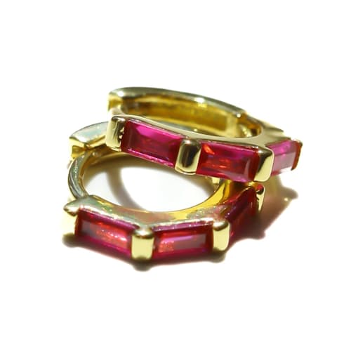 laydown image of Women's Stacked Ruby Huggie Earrings