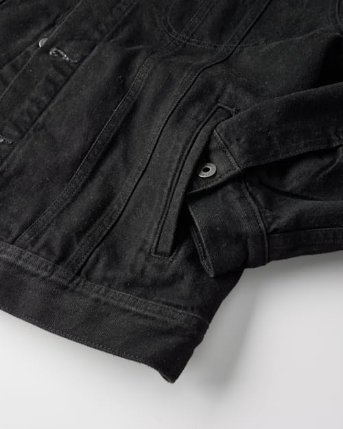 laydown detail image of Flannel-Lined Denim Trucker Jacket