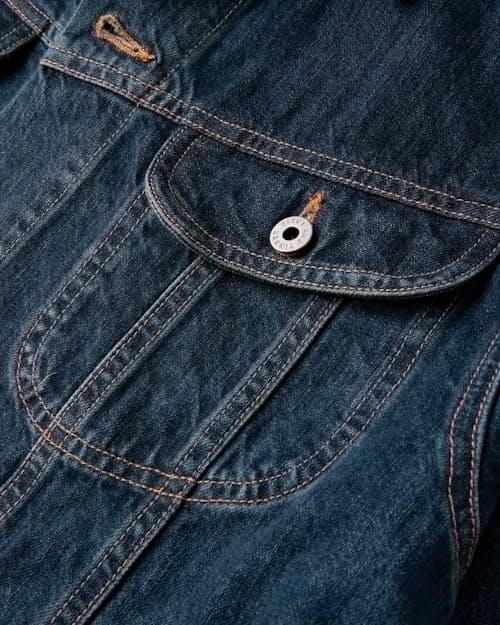 laydown detail image of Unlined Denim Trucker Jacket