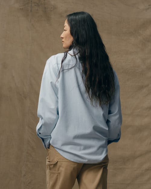 on model image of Women's Embroidered Chambray Shirt