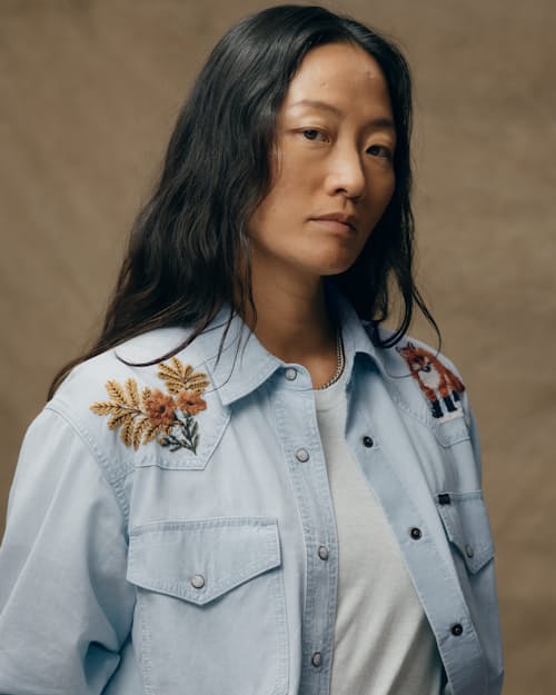 on model image of Women's Embroidered Chambray Shirt