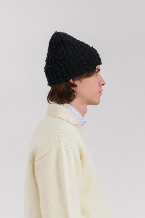 on model image of Cable Festival Hat