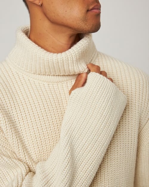 on model image of Wilkinson Turtleneck Sweater
