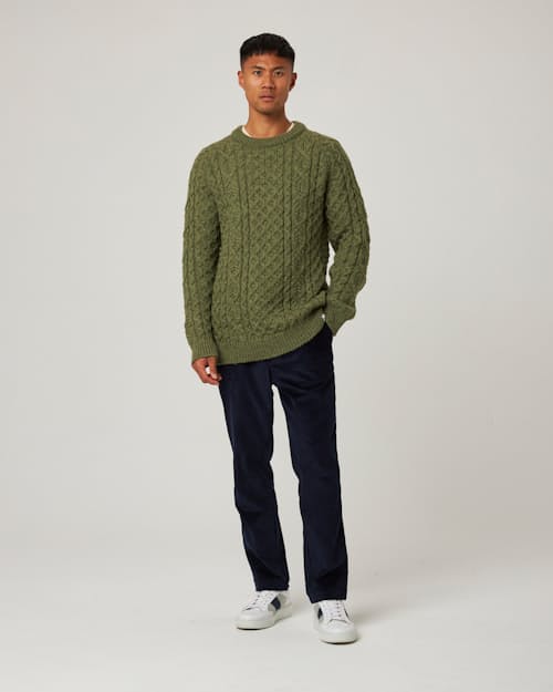 on model image of Hudson Aran Sweater