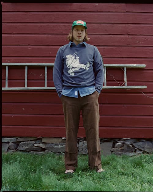 lifestyle image of Wayne Raglan Sleeve Sweatshirt