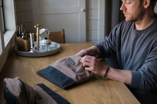 lifestyle image of Neelum Large Zipper Pouch - Khaki