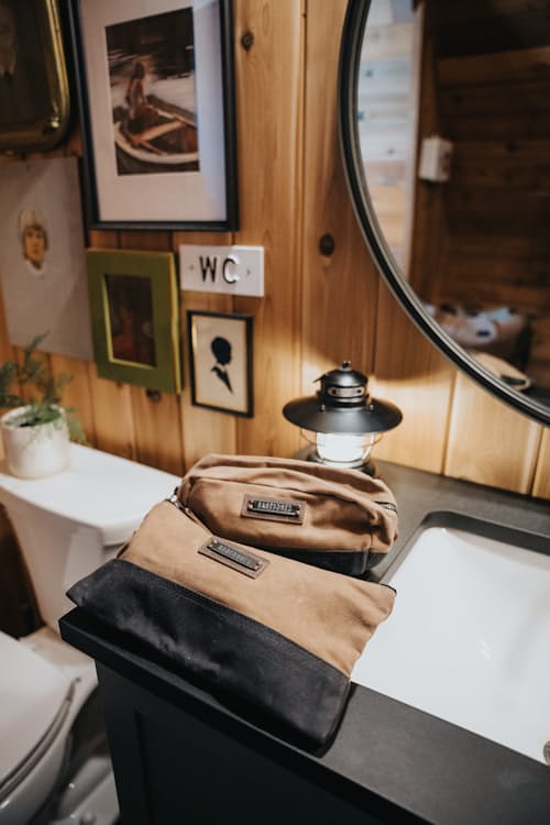 lifestyle image of Neelum Large Zipper Pouch - Khaki