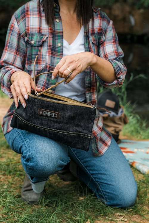 lifestyle image of Neelum Small Zipper Pouch - Denim