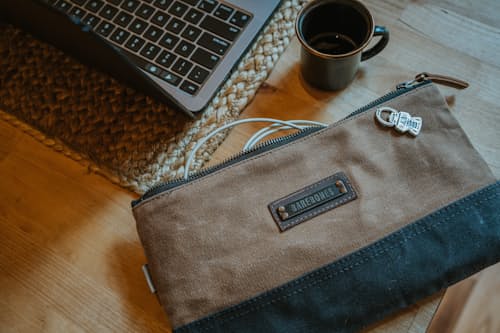 lifestyle image of Neelum Small Zipper Pouch - Khaki