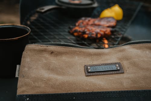 lifestyle image of Neelum Small Zipper Pouch - Khaki