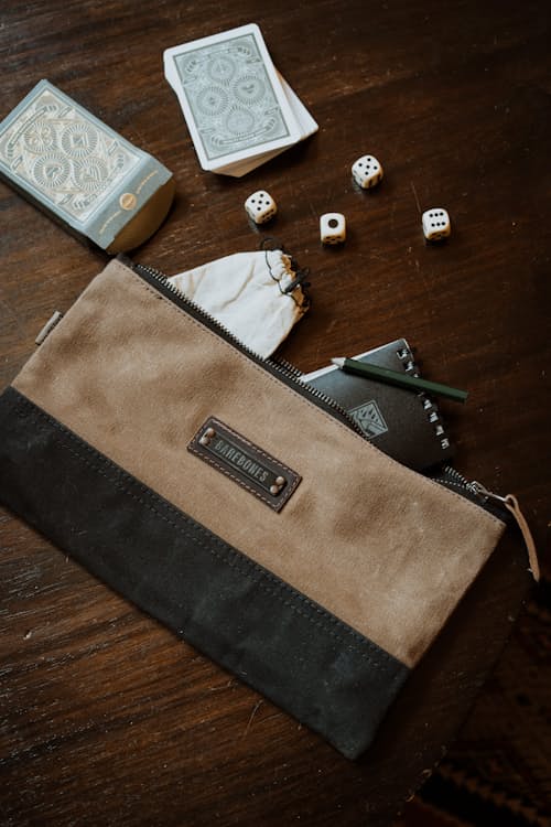 lifestyle image of Neelum Small Zipper Pouch - Khaki
