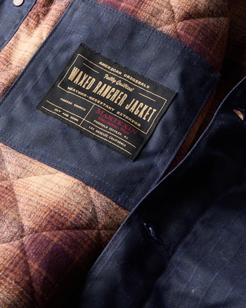 laydown detail image of Flannel-Lined Quilted Waxed Rancher Jacket