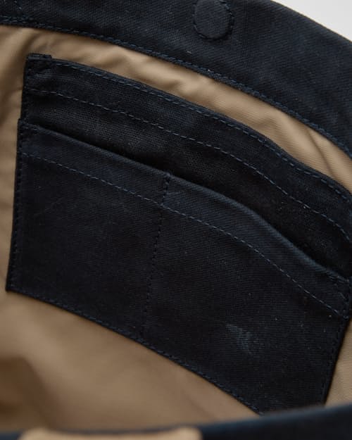 laydown detail image of Coggins Patch Waxed Canvas Tote